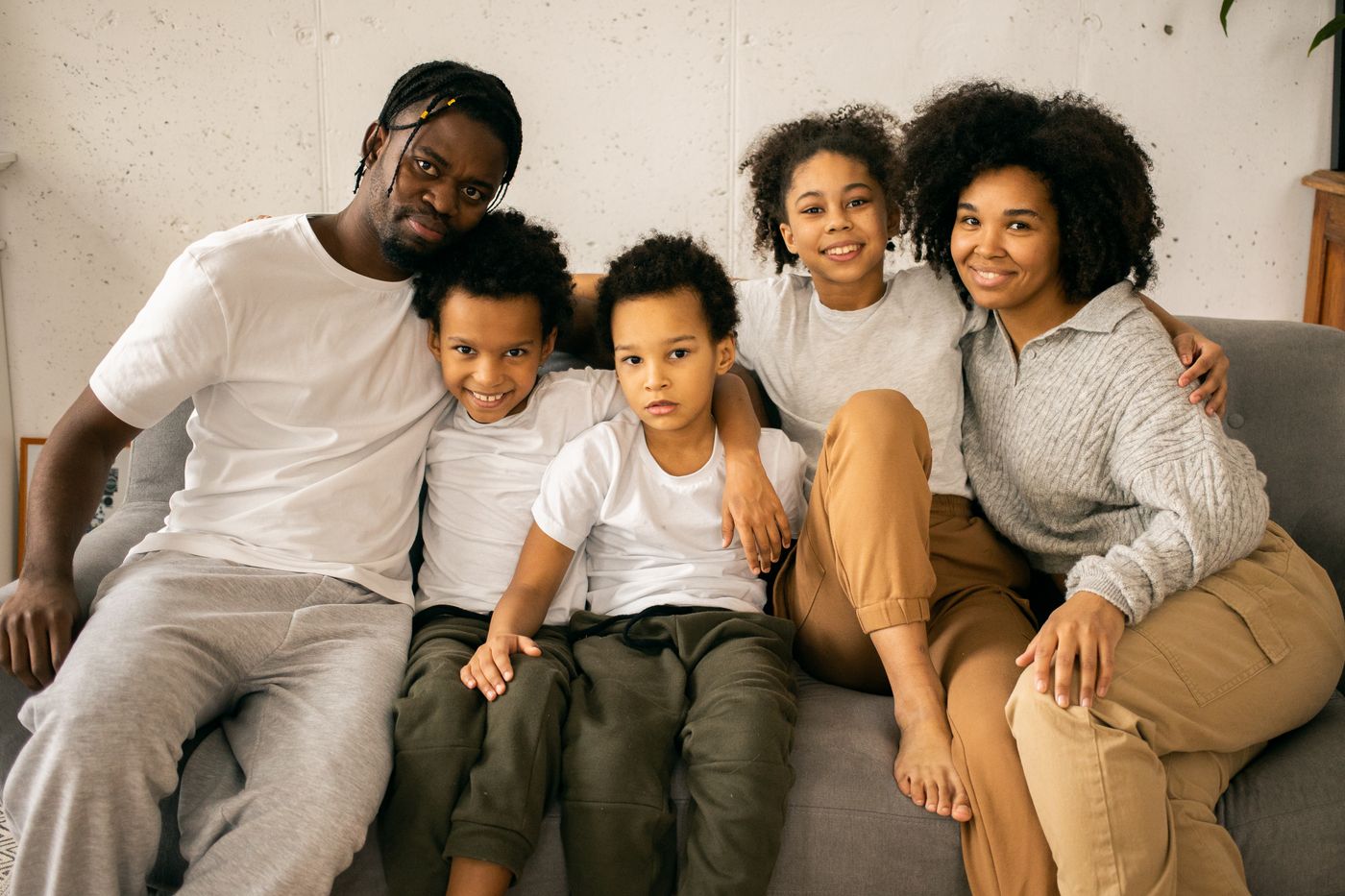 An African American family smiling together